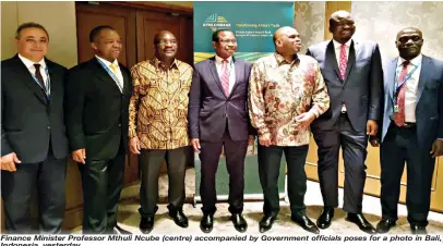  ??  ?? Finance Minister Professor Mthuli Ncube (centre) accompanie­d by Government officials poses for a photo in Bali, Indonesia, yesterday