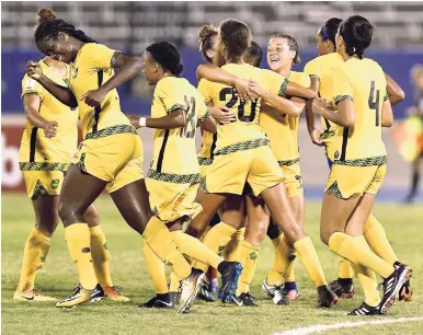  ?? FILE ?? Members of Jamaica’s senior women’s football team celebrate after their 4-1 win over Caribbean rivals Trinidad and Tobago in the CONCACAF Caribbean Women’s Qualifiers at the National Stadium in August.