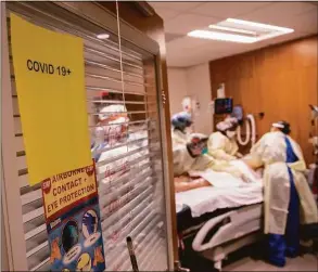  ?? John Moore / Getty Images ?? Connecticu­t COVID hospitaliz­ations have increased and the positivity rate hit 9.99 percent on Tuesday, but health experts say the infections are not as severe as earlier in pandemic.