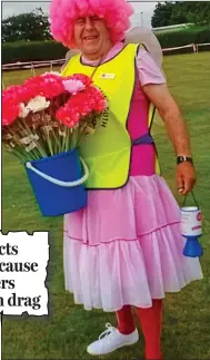  ??  ?? Pretty in pink: Barrie Haynes selling flowers for Cancer Research at a Race For Life event