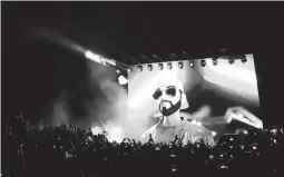  ?? SALVADOR MELENDEZ/AP ?? An avatar of El Salvador President Nayib Bukele is projected during the closing ceremony of a gathering for cryptocurr­ency investors Saturday.