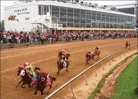  ?? DOUG KAPUSTIN / BALTIMORE SUN ?? Horses round the first turn in the 125th running of the Preakness Stakes at Pimlico in 2000 in Baltimore.