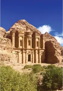  ??  ?? THE MONASTERY. The mountainto­p temple blends into the scenic landscape.