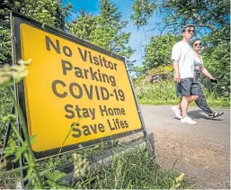  ??  ?? Signs on the Arbroath to Montrose road stating the car park at Lunan Bay is closed. Picture: Mhairi Edwards.