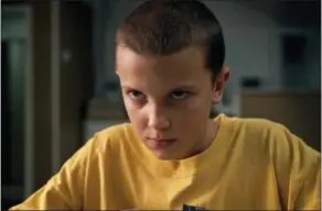  ?? NETFLIX VIA AP ?? This image released by Netflix shows Millie Bobby Brown in a scene from, “Stranger Things.” Brown portrays Eleven, who can move things with her mind and is the fascinatin­g secret friend of a group of pre-teen boys in the fictional town of Hawkins, Ind.