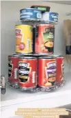  ??  ?? Everything gets its own labelled container, crisps are hung in order and tins on lazy Susan