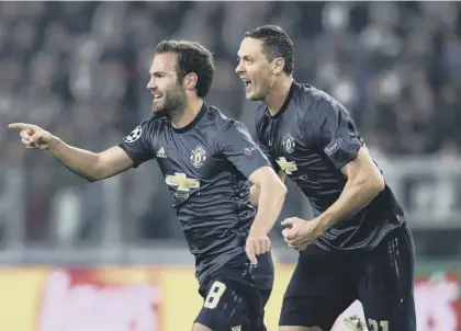  ??  ?? 2 Juan Mata, left, celebrates with Nemanja Matic after equalising for United with a super freekick in the 86th minute.