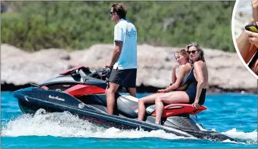  ??  ?? JETSKI SET: Kate and Lila Grace enjoy a ride on the pristine waters that surround their island getaway