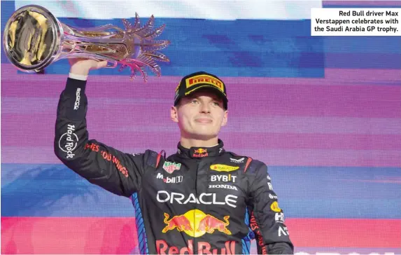  ?? ?? Red Bull driver Max Verstappen celebrates with the Saudi Arabia GP trophy.
FOOTBALL
BASKETBALL