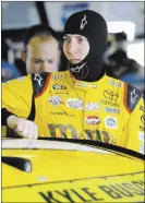  ?? DAVID GRAHAM/THE ASSOCIATED PRESS ?? Defending NASCAR Sprint Cup Series champion Kyle Busch prepares to get in his car Friday to begin practice for Sunday’s Ford Ecoboost 400 at Homestead-Miami Speedway in Homestead, Calif. Busch will be going for a repeat series title today while Jimmie...