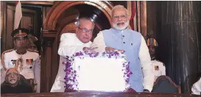  ?? PHOTO: PTI ?? President Pranab Mukherjee and Prime Minister Narendra Modi launch the GST at the Central Hall of Parliament in New Delhi on Saturday