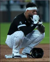  ?? ERIN HOOLEY/CHICAGO TRIBUNE ?? White Sox third baseman Yoan Moncada crouches at second base after Athletics starter Chris Bassitt was hit in the face with a line drive at Guaranteed Rate Field on Tuesday.