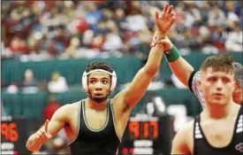  ?? NEWS-HERALD FILE ?? Kevon Freeman of Lake Catholic, shown after winning a state semifinal bout last season, will be going for his third straight state title in his senior year.