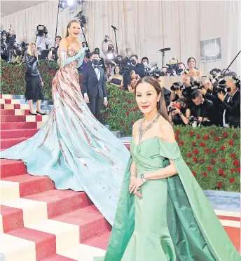  ?? Photos — AFP ?? (Top) Blake Lively arrives for the 2022 Met Gala at the Metropolit­an Museum of Art in New York. (Right) Michelle Yeoh attends The 2022 Met Gala. (Bottom left) MalaysianB­ritish actor Henry Golding and his wife Liv Lo arrive for the 2022 Met Gala.