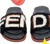  ??  ?? Shearling slides, $1,460, from Fendi. When you need both halves of the pair to see the whole brand name.