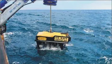  ?? Lt. Curtis Khol U.S. Navy ?? THE U.S. NAVY Undersea Rescue Command deploys a remotely operated vehicle in search of an amphibious assault vehicle that sank off the coast of San Clemente last week during a training exercise, killing nine.