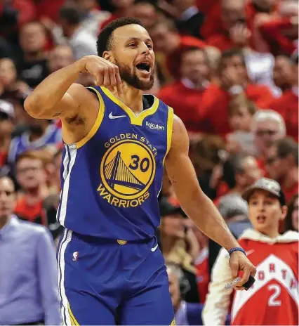  ?? Gregory Shamus / Getty Images ?? Stephen Curry and the champs pulled themselves off the floor just as they were about to be counted out Monday night.