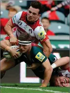  ??  ?? OVER THE LINE: Nick Malouf reaches over to score Leicester’s third try