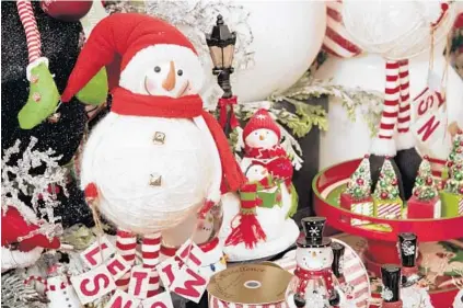  ?? PAUL W. GILLESPIE/BALTIMORE SUN MEDIA GROUP PHOTOS ?? Erin DeHaas, director of special projects for Homestead Gardens in Anne Arundel County, says those decorating for the holidays should have fun doing it. “The holidays are about celebratin­g,” she says.