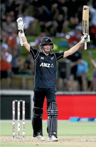  ?? GETTY IMAGES ?? Mitchell Santner celebrates after hitting the winning runs against England at Seddon Park in Hamilton.