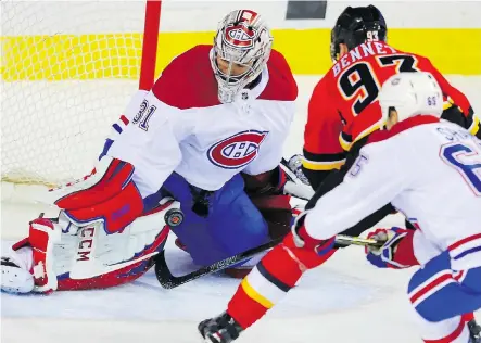  ?? AL CHAREST ?? Canadiens goalie Carey Price turns aside a shot by Sam Bennett of the Flames during action on Friday night at the Scotiabank Saddledome. Bennett was one of the few Calgary forwards to turn in a solid night’s work as Price faced only 23 shots in a 3-2...