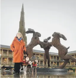  ?? PICTURES: CHRISTOPHE­R FURLONG-GETTY / SIMON HULME ?? FIRST CATCH YOUR HARE: Left, Crawling Lady-Hare and top, Minotaur by Sophie Ryder displayed in the courtyard of Piece Hall; below, with her dogs and one of her sculptures Dancing Hares and below, her work Lady Hare and Boar on a Barrel.