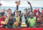  ?? AFP ?? Zimbabwe cricketers celebrate after clinching the ODI series against Sri Lanka 32 in Hambantota on Monday.