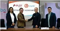  ?? CONTRIBUTE­D PHOTO ?? n PLDT Global President and CEO Albert Villa-real firms the company’s strengthen­ed relations with a handshake with Bayad President and CEO Lawrence Ferrer along with company representa­tives.