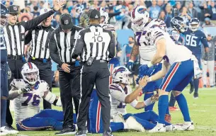  ?? MARK ZALESKI THE ASSOCIATED PRESS ?? Buffalo Bills quarterbac­k Josh Allen lost his footing and failed to convert a fourth-and-inches play from the Tennessee Titans’ three-yard line late in Monday’s game. The Titans won 34-31.