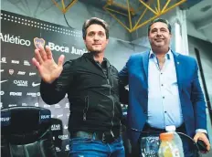  ?? AFP ?? Boca Juniors’ coach Guillermo Barros Schelotto (left) waves ■ during a press conference as Boca Juniors president Daniel Angelici watches, on Friday.