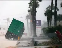  ?? The Associated Press ?? A power generator on a flatbed truck tips in front of a hospital in Corpus Christi,Texas, as Hurricane Harvey hit the area on Friday. Texas Gov. Greg Abbott warned that the monster system would be “a very major disaster.”