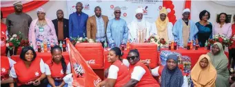  ?? ?? Representa­tives of Nigerian Bottling Company( NBC) and Karis and Eleos hand Foundation with beneficiar­ies of the one week empowermen­t training “NBC EmpowerHer project in Abuja