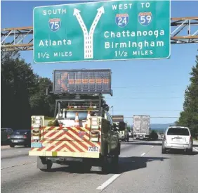  ?? STAFF PHOTO BY ROBIN RUDD ?? Two Tennessee Department of Transporta­tion Highway Response Unit HELP trucks head to a wreck in the eastbound lanes of Interstate 75 recently.