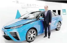  ?? — Reuters ?? Yoshikazu Tanaka, Toyota Motor Corp chief engineer of Mirai fuel cell vehicle (FCV), poses next to the Mirai at the company headquarte­rs in Toyota, Aichi prefecture, Japan.