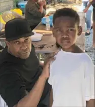  ?? Courtesy of Mark Clayton Southers ?? Denzel Washington, with Andre Joseph Clayton Southers, 8, at the Southers family home in the Hill District on Saturday.