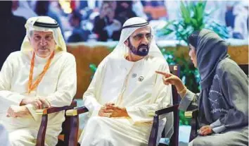  ?? Ahmed Ramzan/ Gulf News ?? Shaikh Mohammad speaks with Mona Ganem Al Merri as Saudi journalist Dr Khalid Al Maeena looks on during the closing ceremony of the Arab Media Forum in Dubai yesterday.