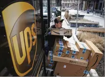  ?? ASSOCIATED PRESS 2018 ?? UPS paid an average of $10.10 per hour for seasonal workers last year. This year, under a new labor contract, pay rates will range from $14 an hour up to, for truck drivers, $30 an hour.