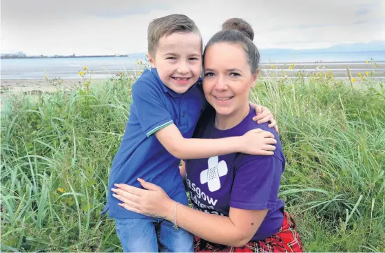  ??  ?? Proud mum Maureen with her son Mason, who suffers from Klippel- Feil syndrome ( KFS), a rare condition which affects the developmen­t of the bones in the spine