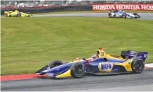  ?? THE ASSOCIATED PRESS ?? Alexander Rossi competes in the IndyCar Series race Sunday at MidOhio Sports Car Course in Lexington, Ohio.