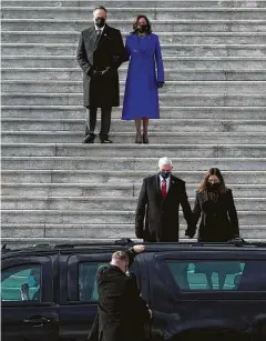  ?? Yalonda M. James / San Francisco Chronicle ?? Above, Doug Emhoff and Vice President Kamala Harris watch former Vice President Mike Pence and his wife, Karen, leave the inaugurati­on.