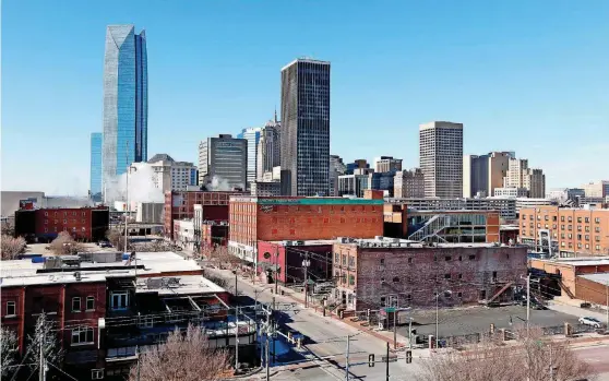  ?? [PHOTO BY STEVE SISNEY, THE OKLAHOMAN] ?? The growth of the downtown skyline is set to continue to expand even as questions persist about the future of downtown office occupancy.