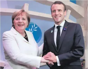  ??  ?? German Chancellor Angela Merkel and President of France Emmanuel Macron