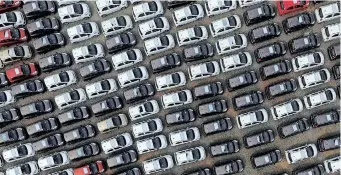  ?? ?? ELECTRIC cars are seen at a parking lot of a car factory in Xingtai, Hebei province, China. This year, statistics indicate electric car sales could reach new highs yet again, with 2 million sold in the first quarter of the year alone – a 75% increase from the same period in 2021, the writer says. | Reuters