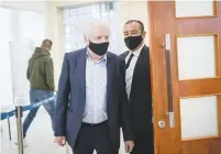  ?? (Yonatan Sindel/Flash90) ?? SHAUL ELOVITCH arrives at the Jerusalem District Court yesterday.