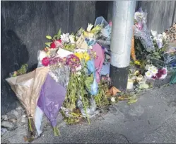  ??  ?? Floral tributes to Ryan Males, who died after falling from the Panorama building in Ashford