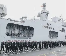  ??  ?? The ship’s company forms a guard of honour during the decommissi­oning ceremony for HMS Ocean. Pic: PA.