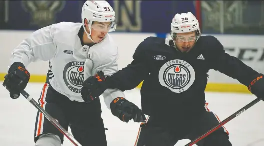  ?? LARRY WONG ?? Edmonton Oilers Ryan Nugent-hopkins, left, and Kailer Yamamoto prepare for the season ahead at training camp at the Northern Alberta Institute of Technology on Sunday.