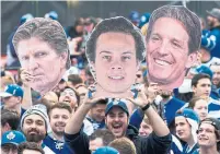  ?? KEVIN SOUSA GETTY IMAGES ?? Fans hold up images of Mike Babcock, Auston Matthews and Brendan Shanahan during the 2019 playoffs.