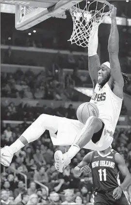  ?? Wally Skalij Los Angeles Times ?? RESERVE MONTREZL HARRELL, who led the Clippers with 26 points and 10 rebounds, dunks against the Pelicans in the second quarter.