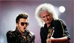  ?? AP PHOTO/FELIPE DANA, FILE ?? In this September 2015 photo, Adam Lambert, left, and Brian May of the Queen + Adam Lambert perform at the Rock in Rio music festival in Rio de Janeiro, Brazil. Many of the rock ‘n’ roll bands that were huge in 1977 will comprise a big part of the...